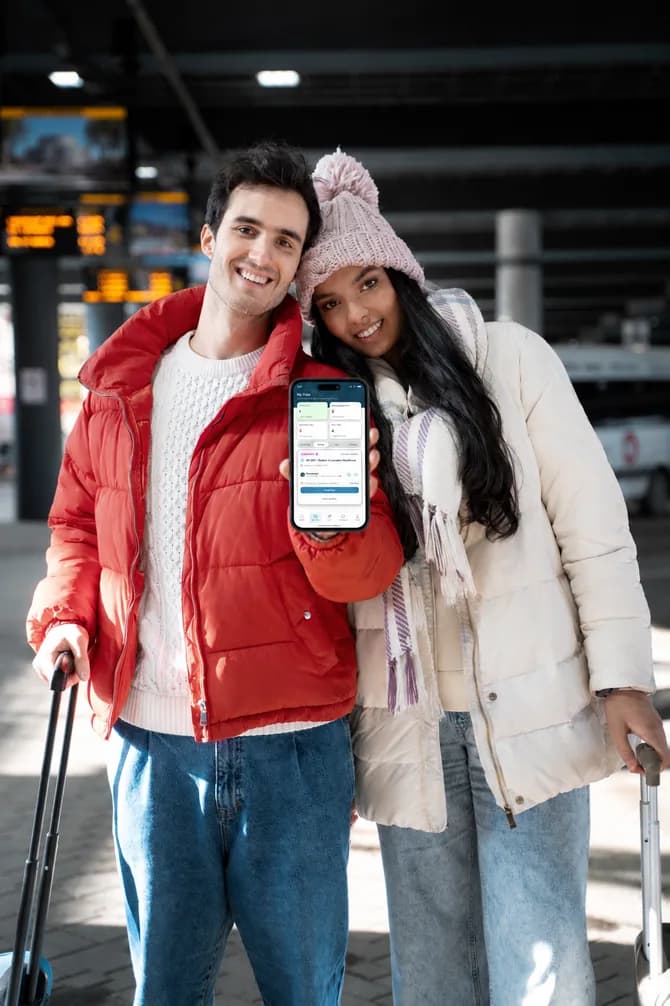 Two travelers checking the Worldwide Greeter app on a phone