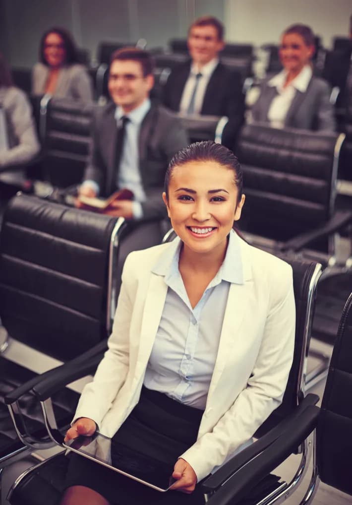 An executive with colleagues before a business trip