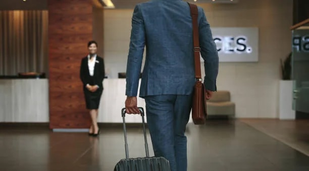 A greeter assisting a traveler between connecting flights