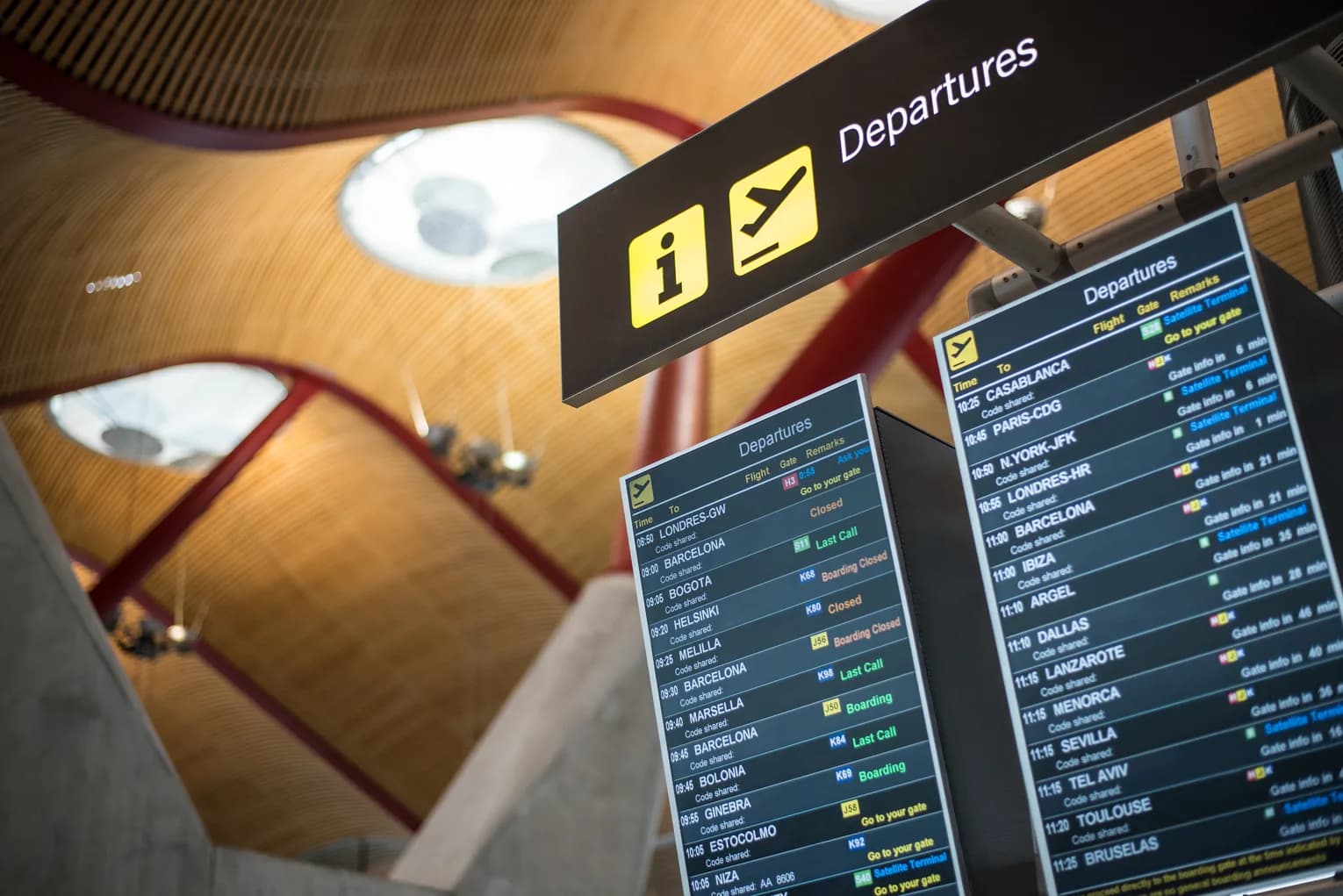 An airport departures timetable board listing outbound flights