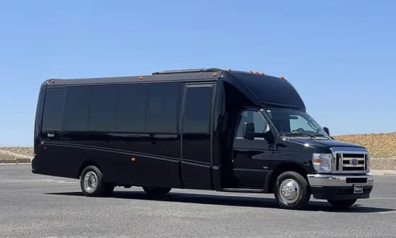 A mid-size luxury minibus used for event transfers